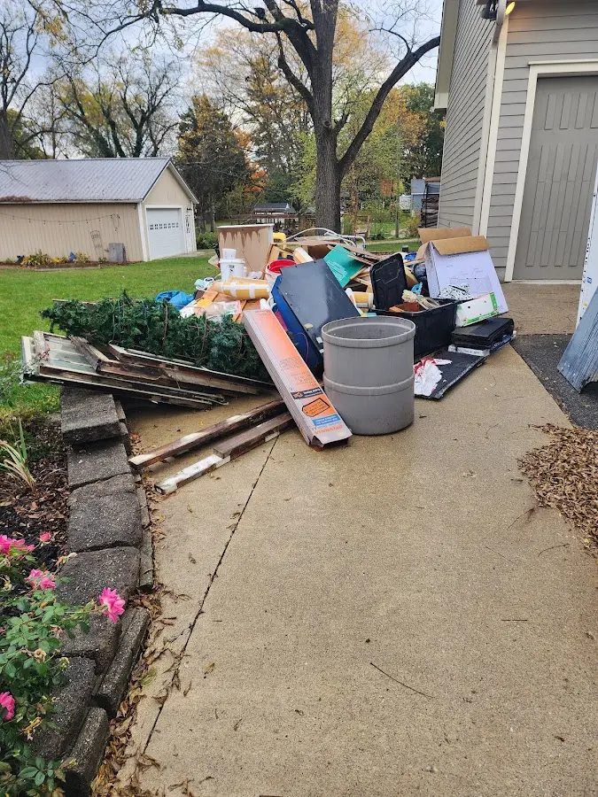 Dumpster being loaded with debris for Commercial Dumpster Rental in Jaffrey
